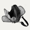 Interior view of Travelpro Altitude Crossbody 6L in Black, showing dual compartments with gray lining and tablet sleeve.
