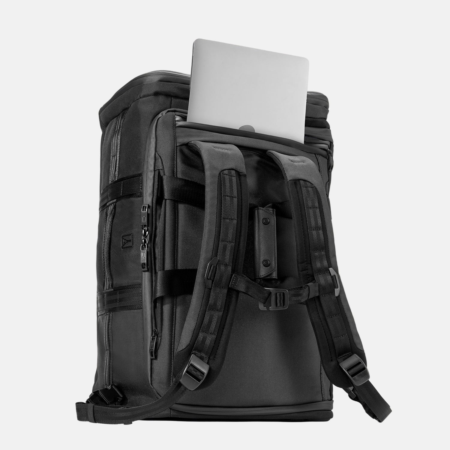 Back view of the Travelpro Convertible Duffel/Backpack in black, featuring padded backpack straps and rear laptop pocket with laptop partially inserted.

