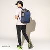Person wearing a stellar navy backpack on a white background