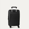 Rear view of the Optima Expandable Compact Carry-on Spinner in Black, showcasing the durable polypropylene shell, the extended telescoping PowerScope handle, and smooth-rolling spinner wheels.