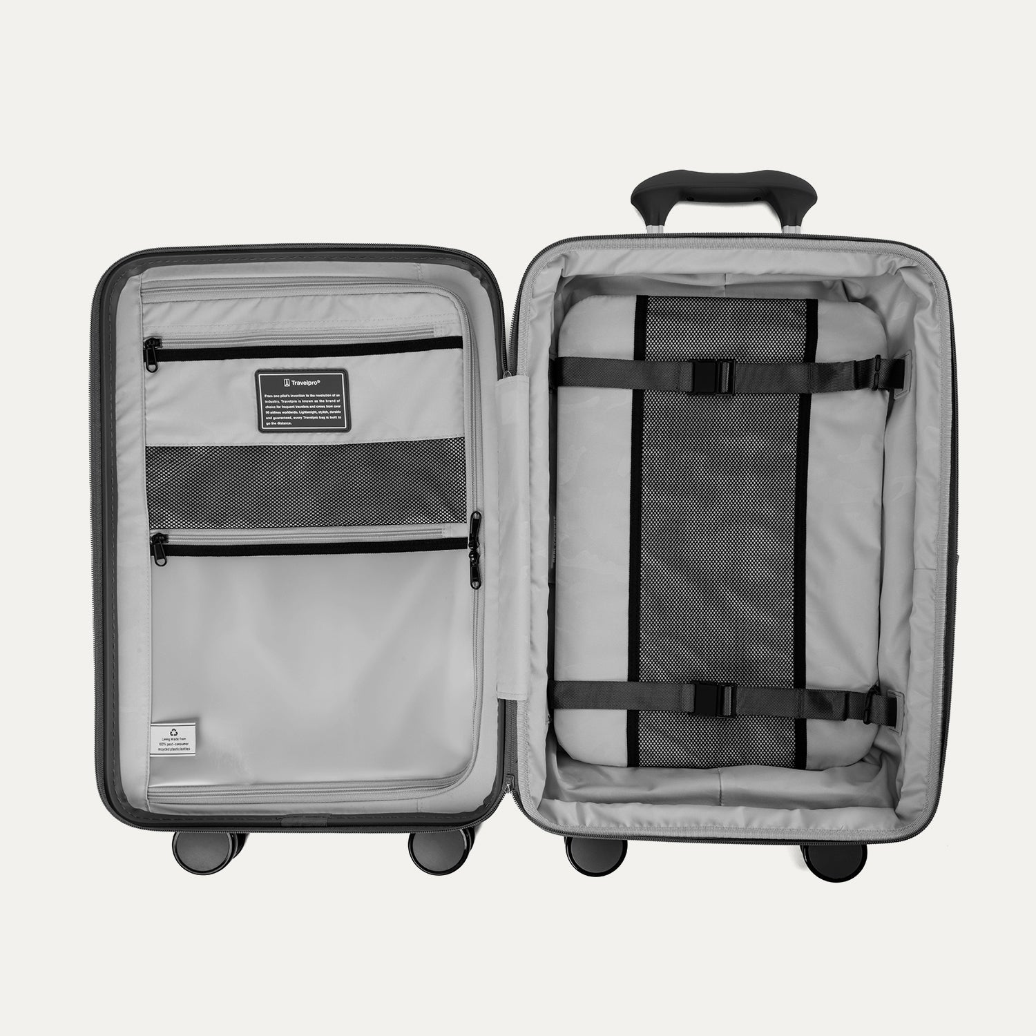 Open interior view of the Optima Expandable Compact Carry-on Spinner in Black, showcasing the organized packing system with a built-in compression panel, zippered divider, accessory pockets, and ECOFAB™ interior lining.