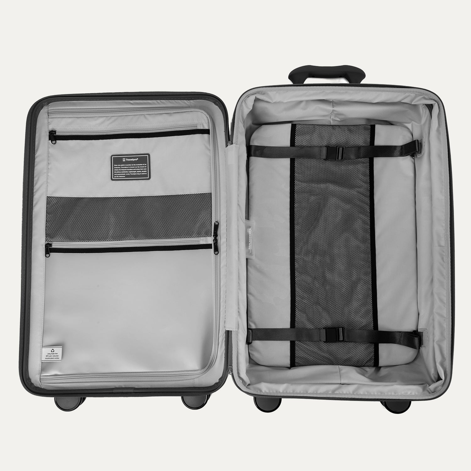 Interior view of the Optima Expandable Medium Check-in Spinner in Black, featuring a built-in compression panel, zippered divider, and multiple accessory pockets to help keep packed items organized and secure.