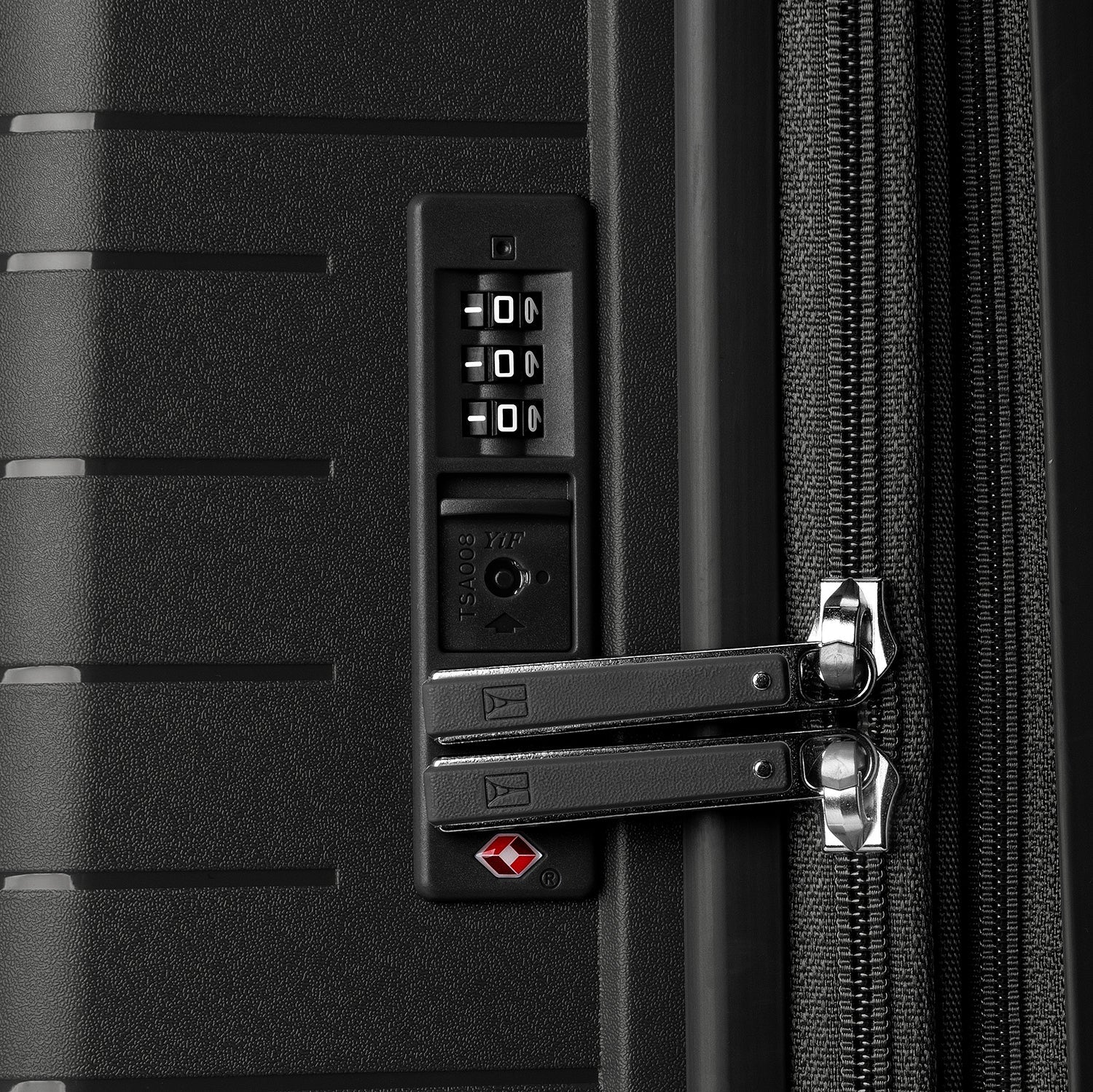 Close-up detail view of the TSA-compliant combination lock on the Optima Expandable Large Check-in Spinner in Black, showcasing the integrated security feature designed for safe and accessible travel.
